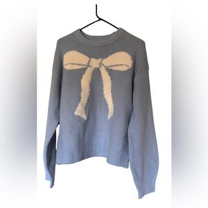 a new day light Blue Sweater with white Bow Accent